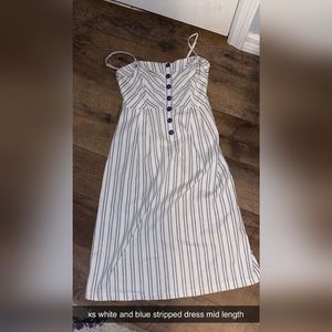 Navy and white pinstripes dress.  Mid length.